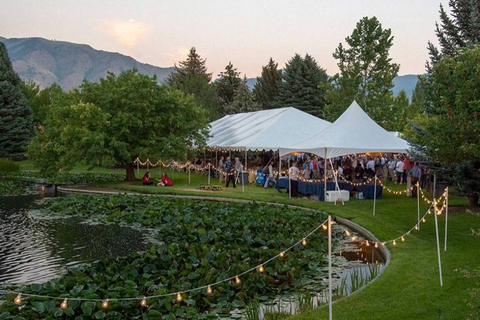 Corporate outdoor event - tent by the pond