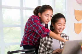 teenage girls at computer